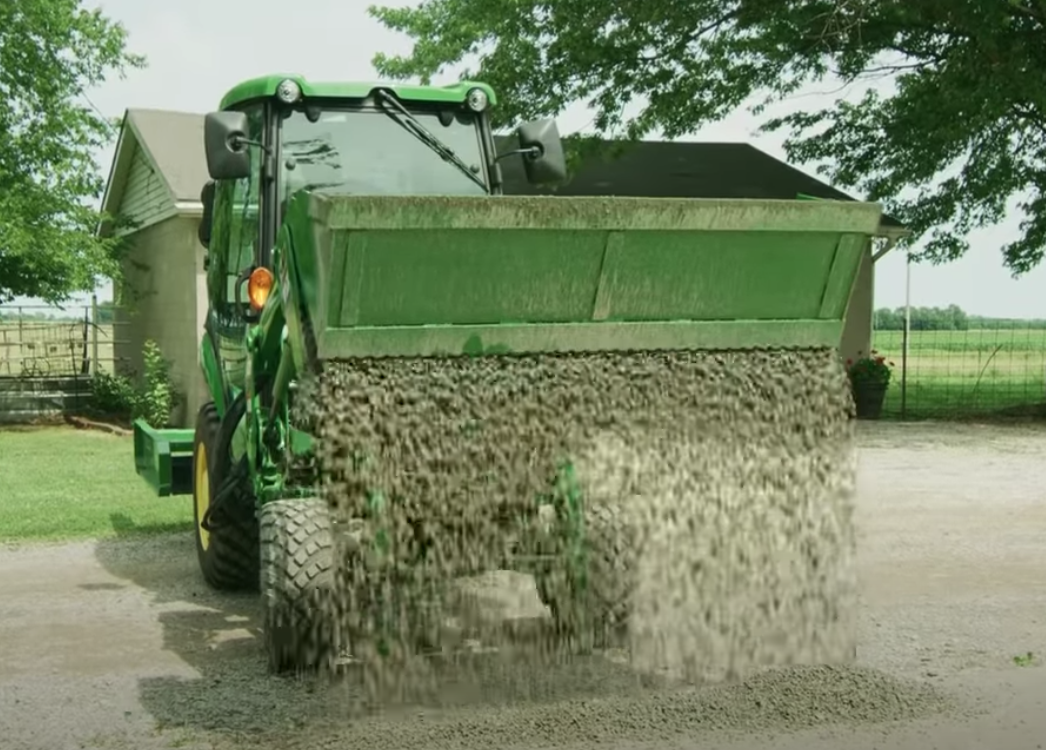Using a Frontier 4-in-1 Bucket to maintain a gravel drive.