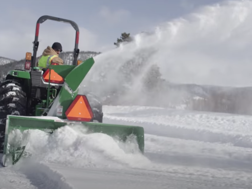 Removing snow using a Frontier Snowblower.